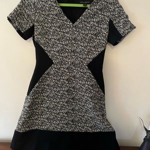 Black/beige patterned dress with lining.